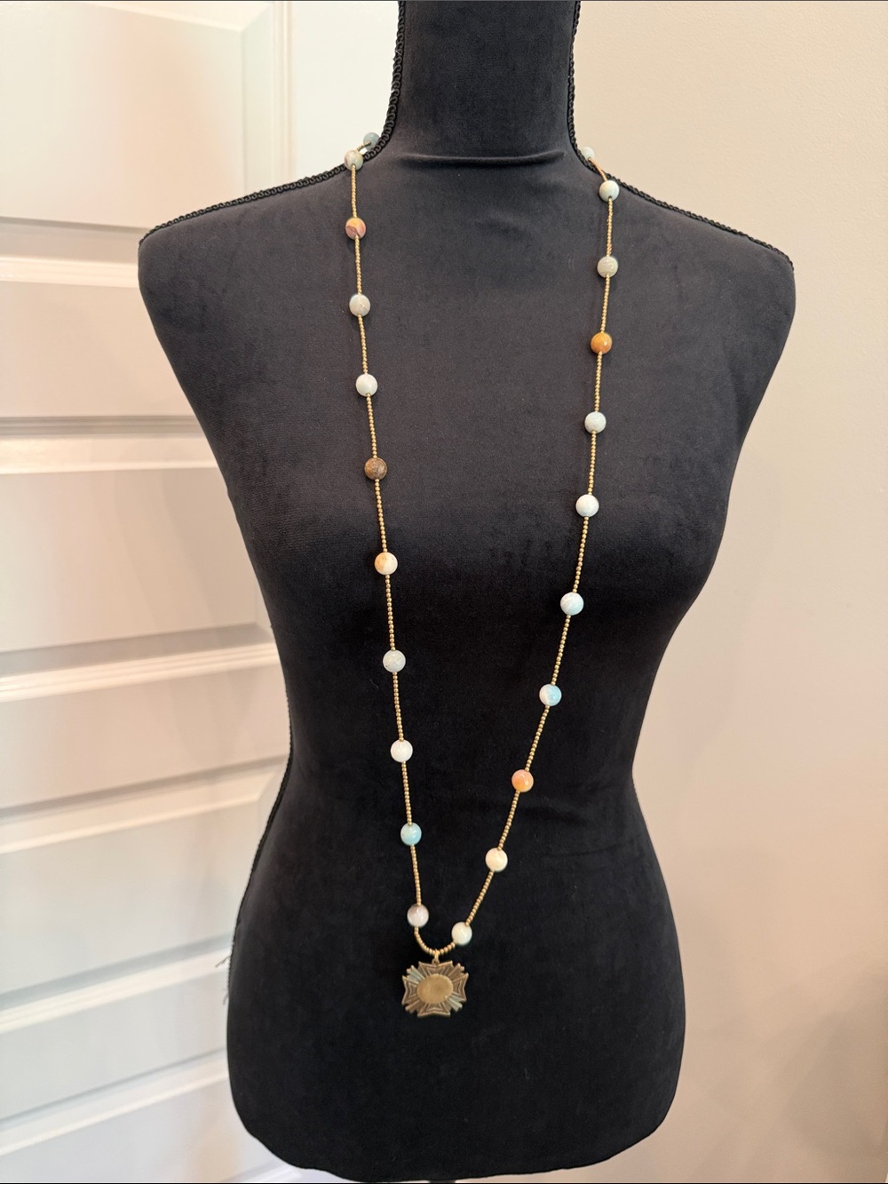 Long Gold Bead Necklace with Multicolor Beads and Sun Medallion